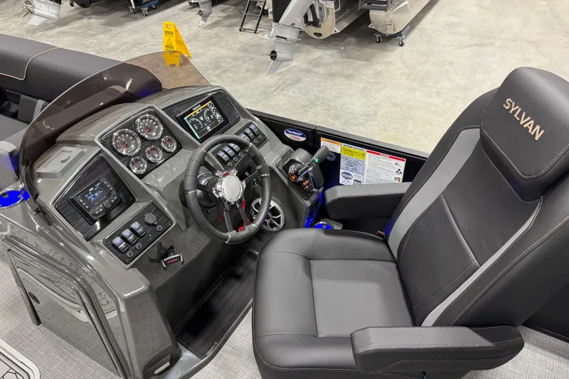 Slide: The Image of 2026 Sylvan Mirage X X5 boat cockpit with modern controls and comfortable seating. - 16