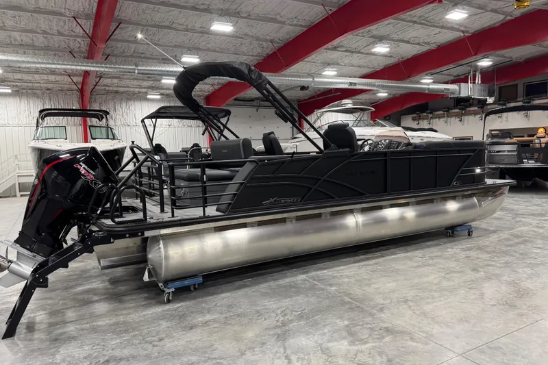 Slide: The Image of 2026 Sylvan Mirage X X5 pontoon boat in a showroom, featuring sleek design and modern amenities. - 4