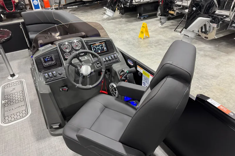 Slide: The Image of 2026 Sylvan Mirage X X5 boat cockpit with modern steering and controls. - 8