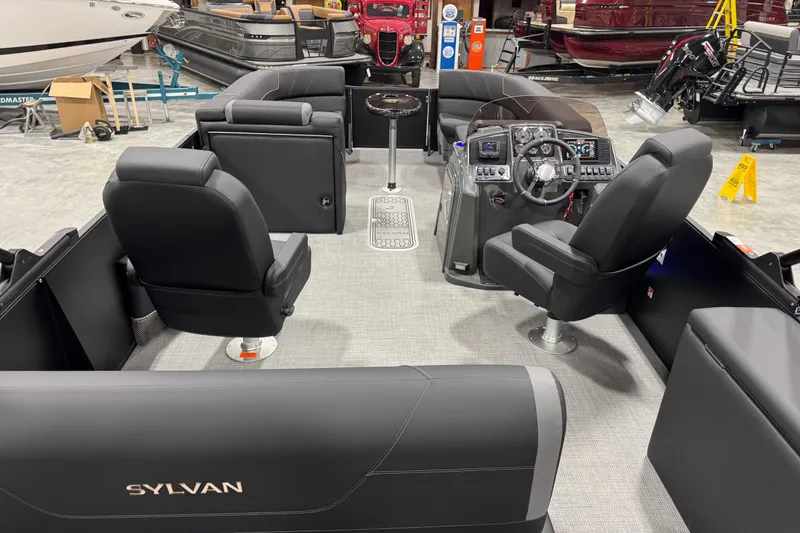 Slide: The Image of Interior of 2026 Sylvan Mirage X X5 pontoon boat with modern seating and controls. - 9