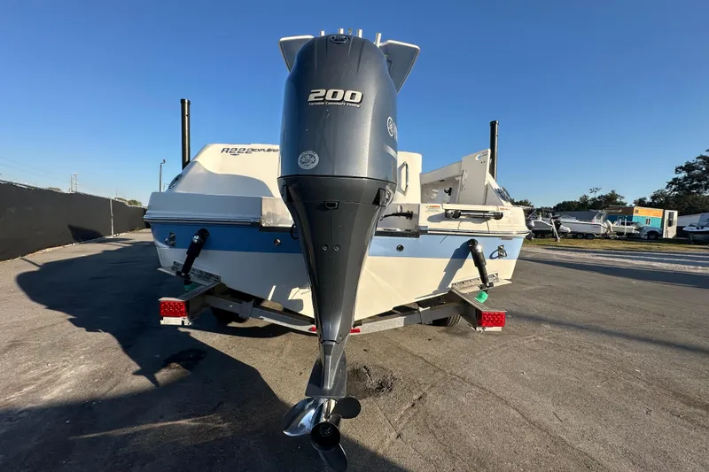 Slide: The Image of 2023 Robalo R222 Center Console with Yamaha outboard motor, close-up view. - 10