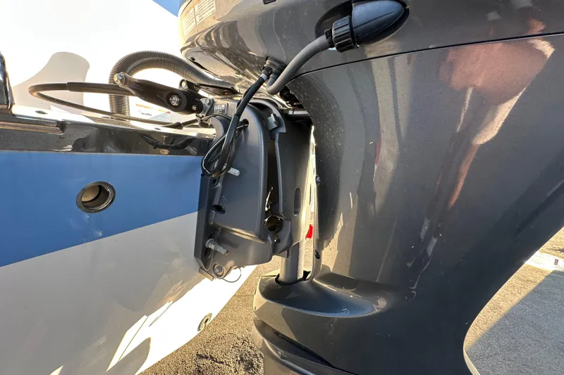 Slide: The Image of 2023 Robalo R222 Center Console boat propeller close-up on pavement. - 11