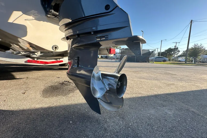 Slide: The Image of 2023 Robalo R222 Center Console boat propeller on trailer, close-up view. - 13