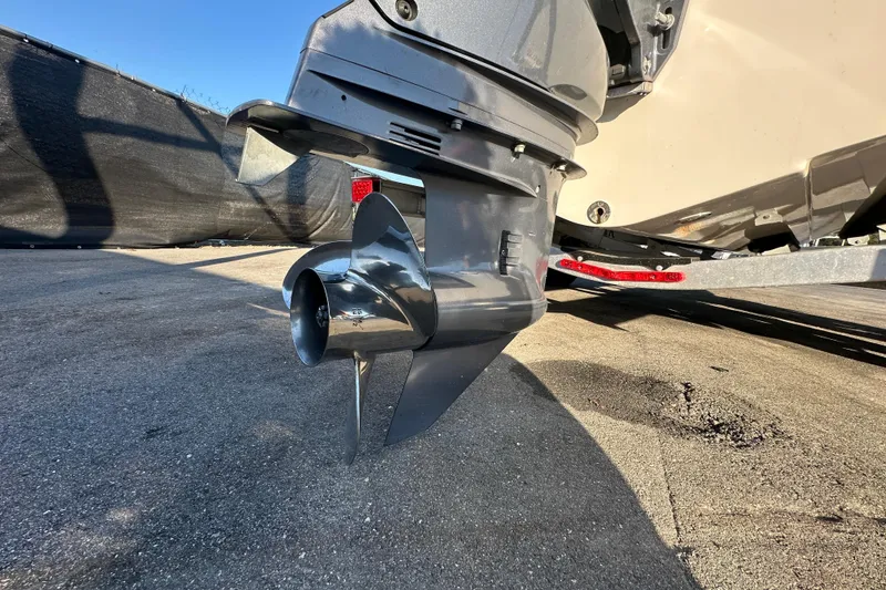 Slide: The Image of Trailer wheels of a 2023 Robalo R222 Center Console boat on pavement. - 15