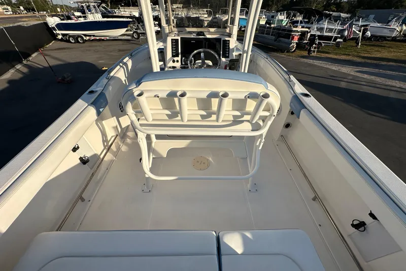 Slide: The Image of 2023 Robalo R222 Center Console boat interior with seating and console view. - 19