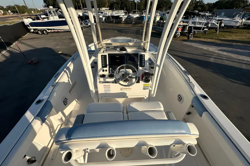 Slide: The Image of 2023 Robalo R222 Center Console boat interior with steering wheel and seating. - 23
