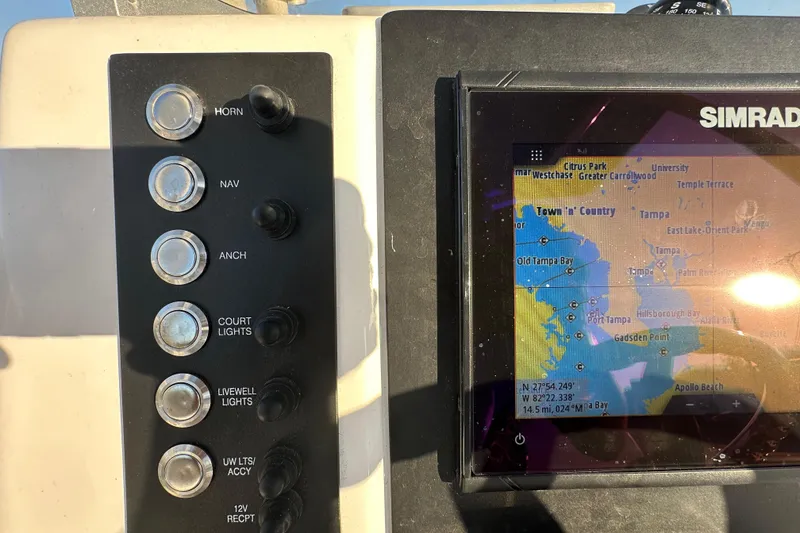 Slide: The Image of 2023 Robalo R222 Center Console dashboard with navigation and control systems. - 26