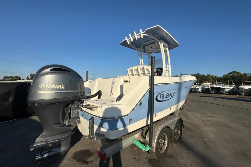 Slide: The Image of 2023 Robalo R222 Center Console boat on trailer, street view. - 3