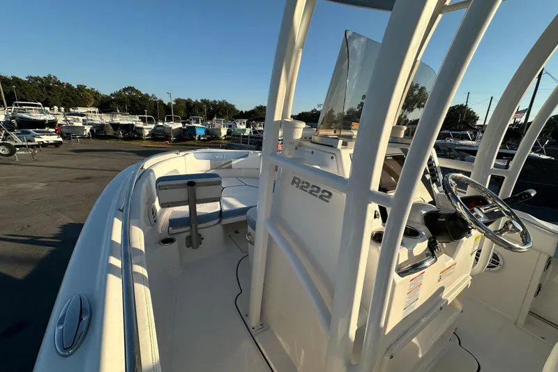 Slide: The Image of 2023 Robalo R222 Center Console boat controls with Yamaha throttle and trim switch. - 33