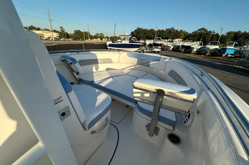 Slide: The Image of 2023 Robalo R222 Center Console boat, docked with clear blue sky background. - 36