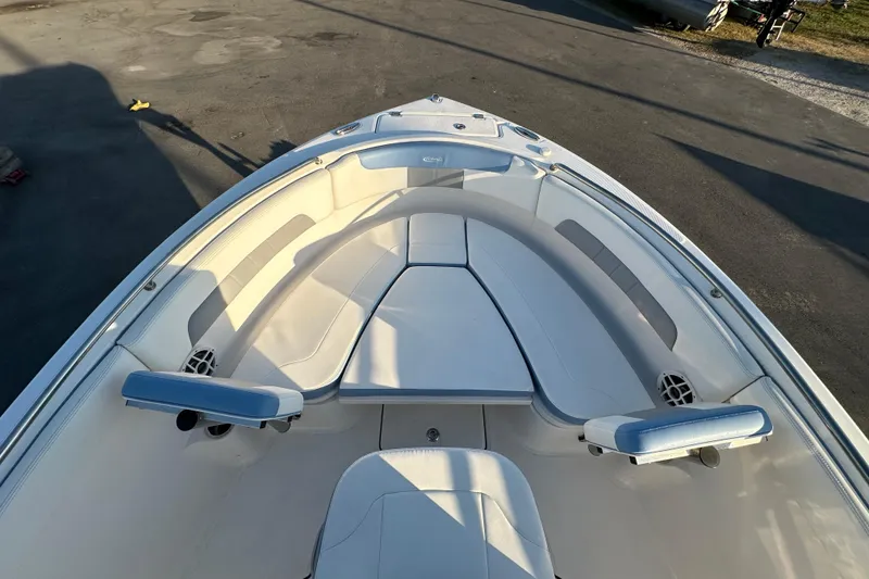 Slide: The Image of 2023 Robalo R222 Center Console boat interior with seating and cup holder. - 37