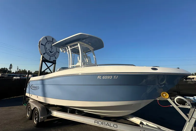 Slide: The Image of 2023 Robalo R222 Center Console boat on trailer at dealership. - 4