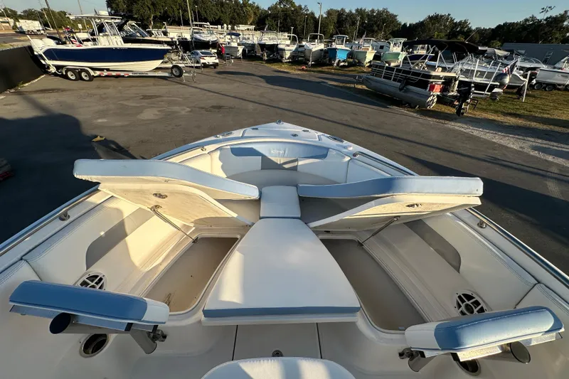 Slide: The Image of 2023 Robalo R222 Center Console boat interior with cushioned seating. - 40