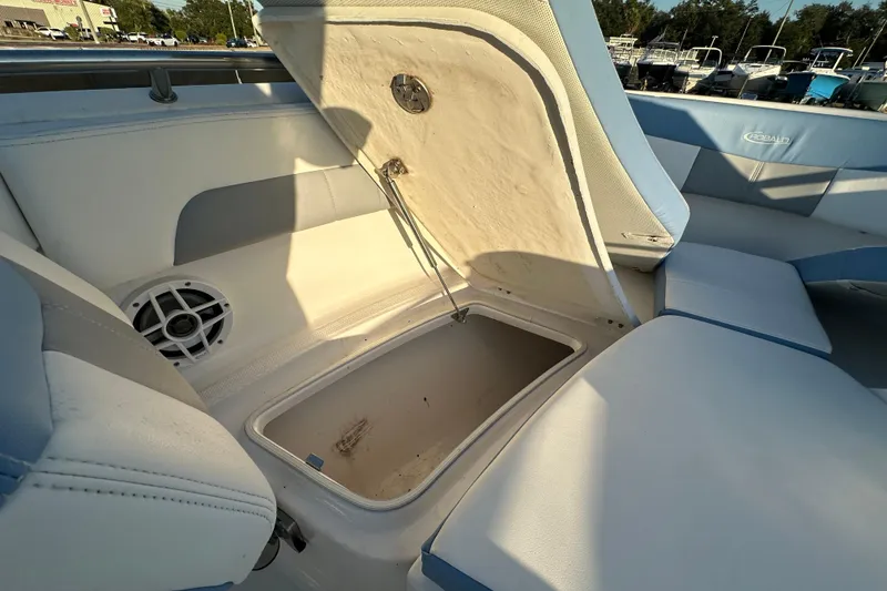 Slide: The Image of 2023 Robalo R222 Center Console boat interior with seating and storage compartments. - 41