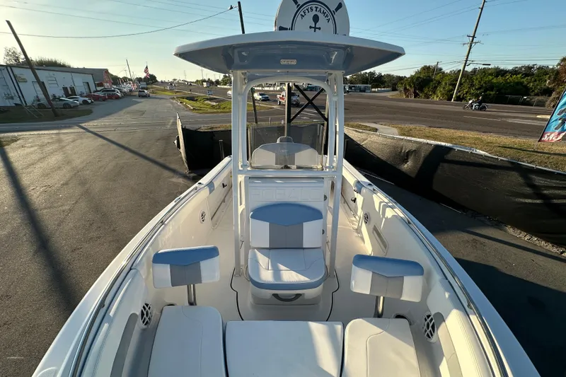 Slide: The Image of 2023 Robalo R222 Center Console boat storage compartment with open seat and speaker. - 44