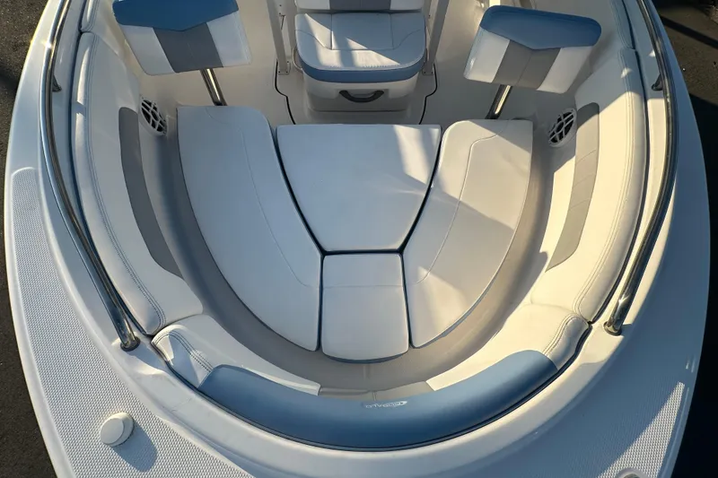 Slide: The Image of 2023 Robalo R222 Center Console boat, docked, showcasing seating and helm area. - 46