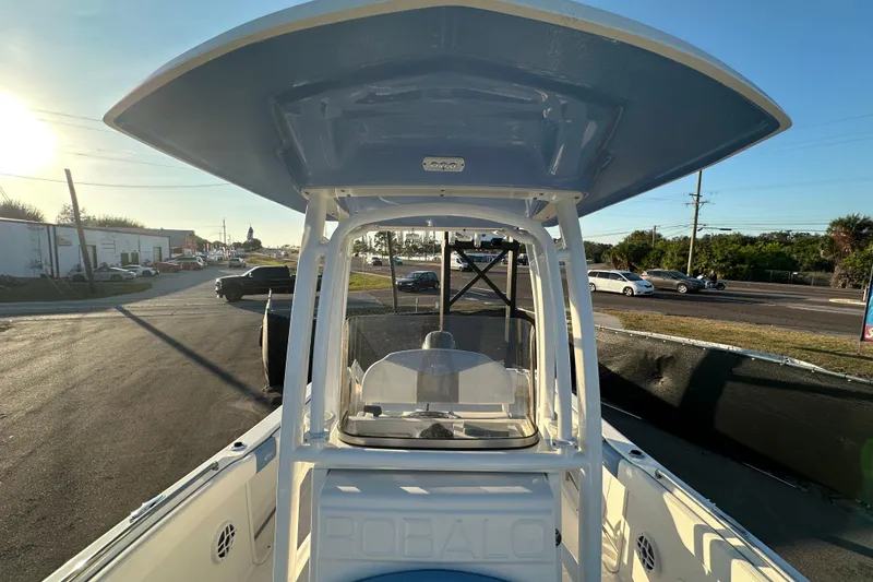 Slide: The Image of 2023 Robalo R222 Center Console boat interior with cushioned seating and speaker. - 49