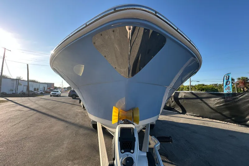 Slide: The Image of 2023 Robalo R222 Center Console boat on trailer, side view. - 5