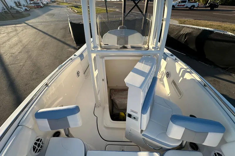 Slide: The Image of 2023 Robalo R222 Center Console boat, viewed from the deck, under a clear sky. - 51