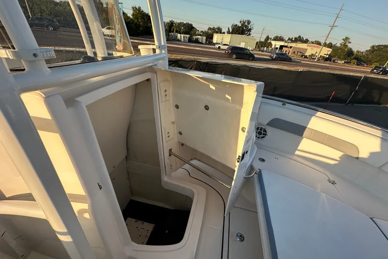 Slide: The Image of 2023 Robalo R222 Center Console boat interior with seating and console view. - 52