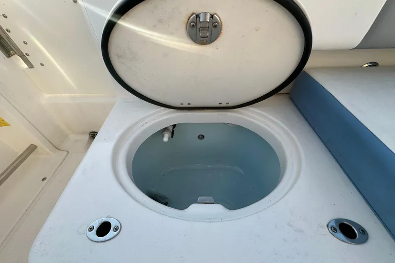 Slide: The Image of 2023 Robalo R222 Center Console boat seat in sunlight, showcasing comfortable design. - 59