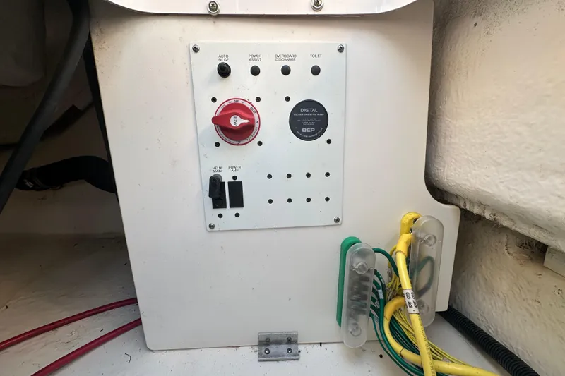 Slide: The Image of 2023 Robalo R222 Center Console boat wiring and battery compartment. - 65