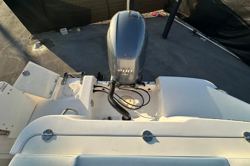 Slide: The Image of 2023 Robalo R222 Center Console interior with rod holders and seating. - 69