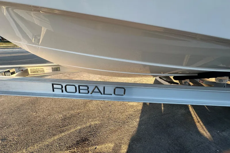 Slide: The Image of 2023 Robalo R222 Center Console boat with Yamaha engine on trailer. - 7
