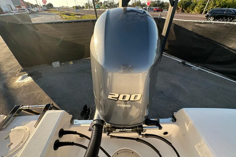 Slide: The Image of 2023 Robalo R222 Center Console interior detail with coiled hose and seating. - 70