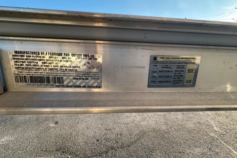 Slide: The Image of 2023 Robalo R222 Center Console trailer labels with tire and loading information. - 74