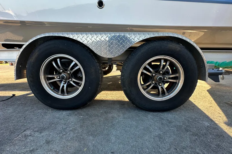 Slide: The Image of 2023 Robalo R222 Center Console boat engine detail in sunlight. - 9