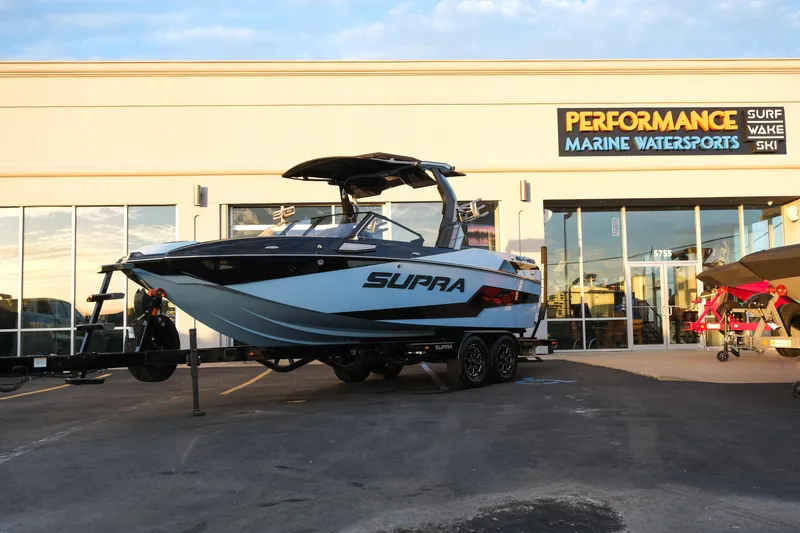 The Image of 2024 Supra SL boat displayed at Performance Marine Watersports dealership. - 0