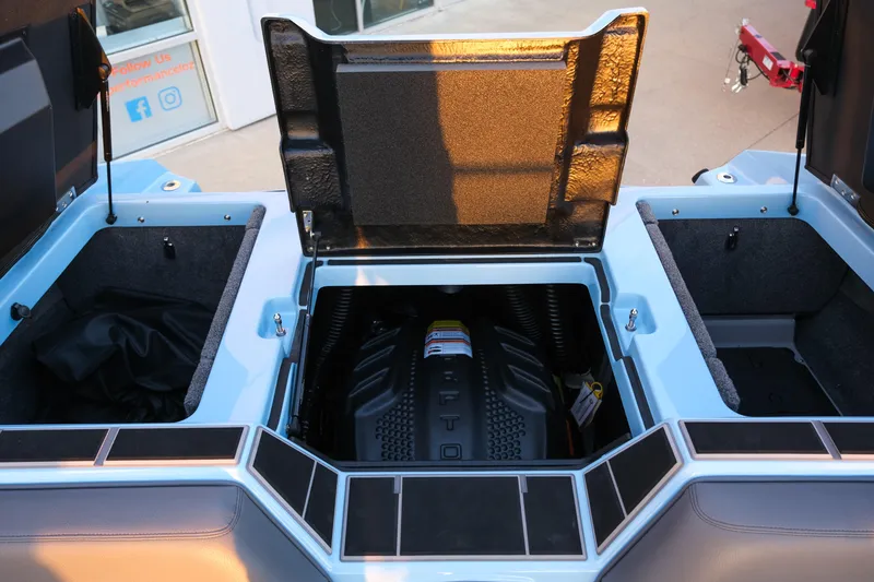 Slide: The Image of 2024 Supra SL engine compartment with open hatches, showcasing storage and engine details. - 25
