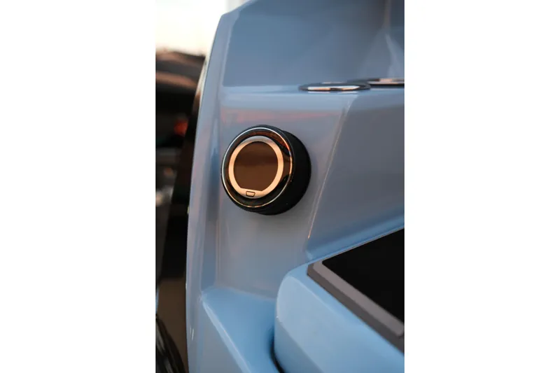 Slide: The Image of 2024 Supra SL boat dashboard with sleek control knob in focus. - 27