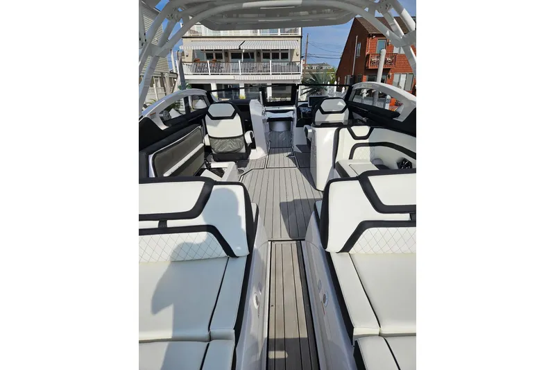 Slide: The Image of 2024 Yamaha Boats 275SD interior with luxurious seating and modern design. - 14