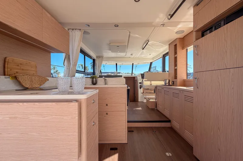 Slide: The Image of Interior of 2026 Beneteau Swift Trawler 41 Fly, modern kitchen and helm area. - 15