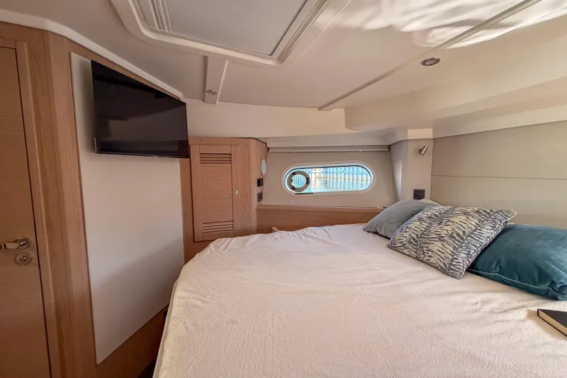 Slide: The Image of Interior of 2026 Beneteau Swift Trawler 41 Fly with bed and window. - 21