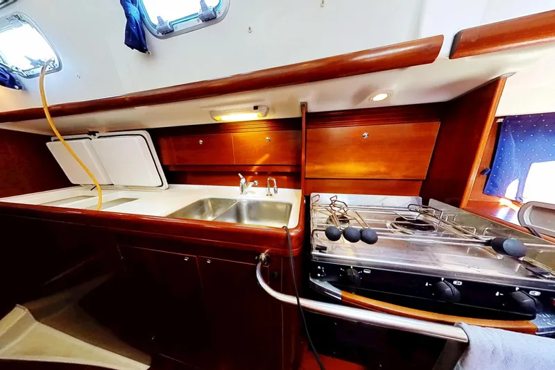 Slide: The Image of Interior of 2003 Beneteau Oceanis 42CC yacht kitchen with sink and stove. - 12