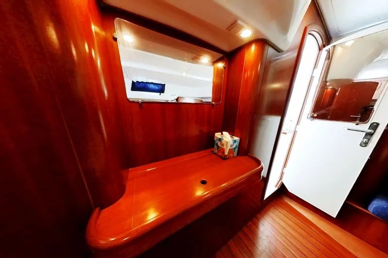 Slide: The Image of Interior of 2003 Beneteau Oceanis 42CC yacht with wooden finish and mirror. - 18