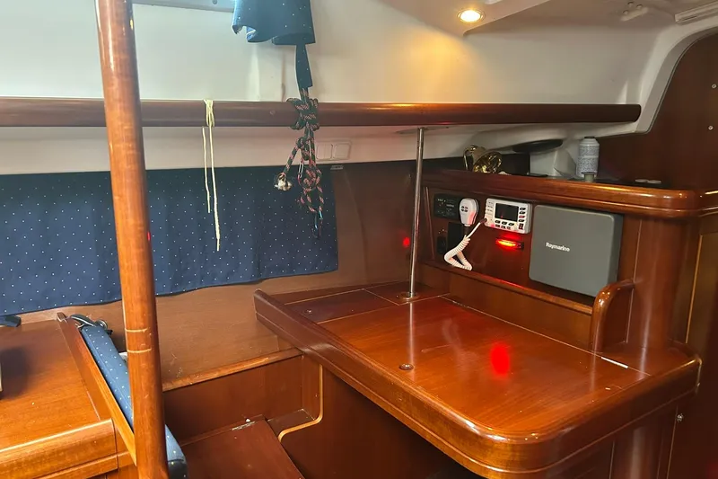 Slide: The Image of Interior of 2003 Beneteau Oceanis 42CC yacht with navigation equipment and wooden finish. - 32