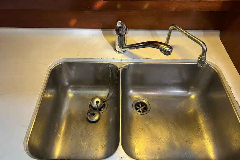 Slide: The Image of Stainless steel double sink with faucet on Beneteau Oceanis 42CC yacht, 2003 model. - 38