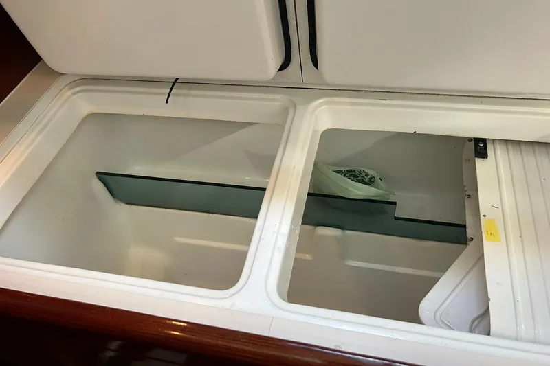 Slide: The Image of Open storage compartment in 2003 Beneteau Oceanis 42CC sailboat interior. - 40
