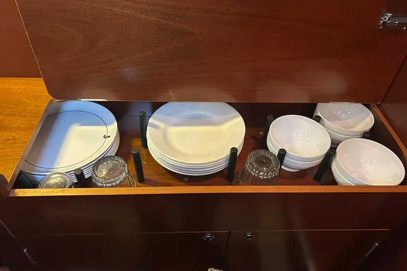 Slide: The Image of Cabinet with dishes and glasses on a 2003 Beneteau Oceanis 42CC yacht. - 42