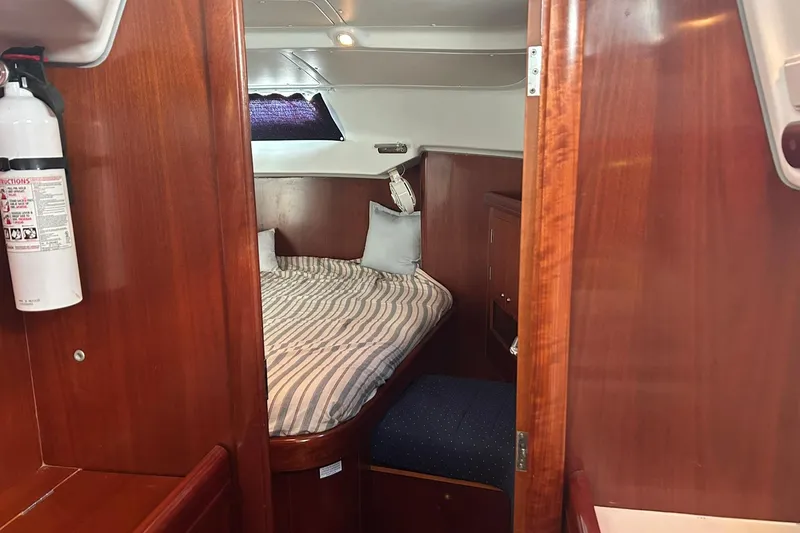 Slide: The Image of Cozy cabin interior of 2003 Beneteau Oceanis 42CC sailboat with wooden finish. - 43