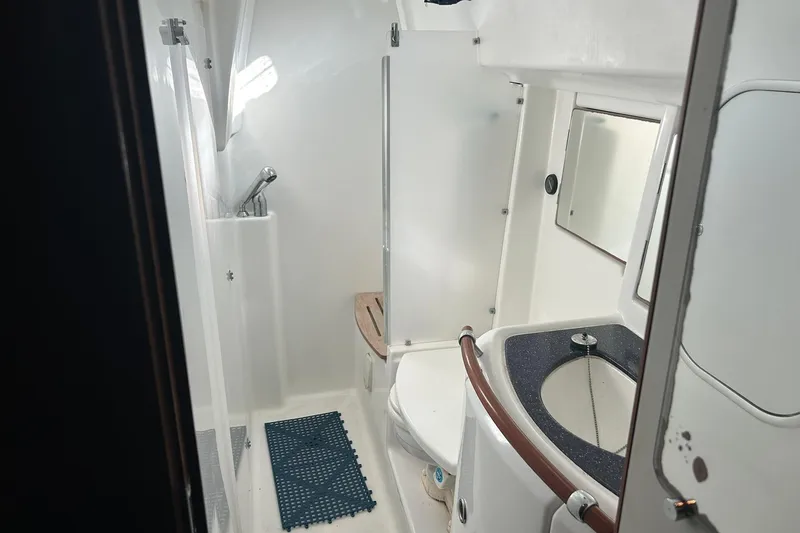 Slide: The Image of Bathroom interior of 2003 Beneteau Oceanis 42CC yacht, featuring shower and sink. - 54