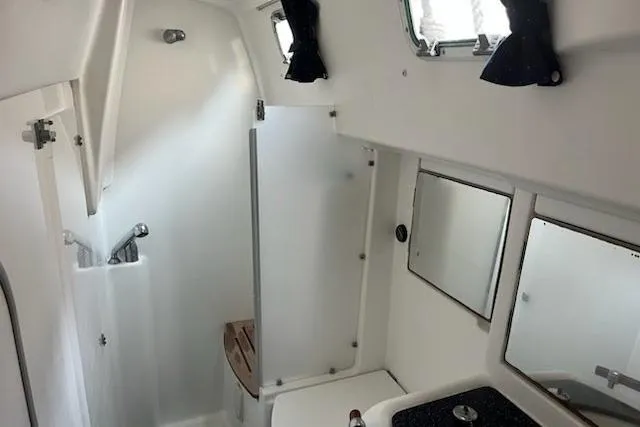 Slide: The Image of Interior of 2003 Beneteau Oceanis 42CC yacht bathroom with shower and sink. - 55