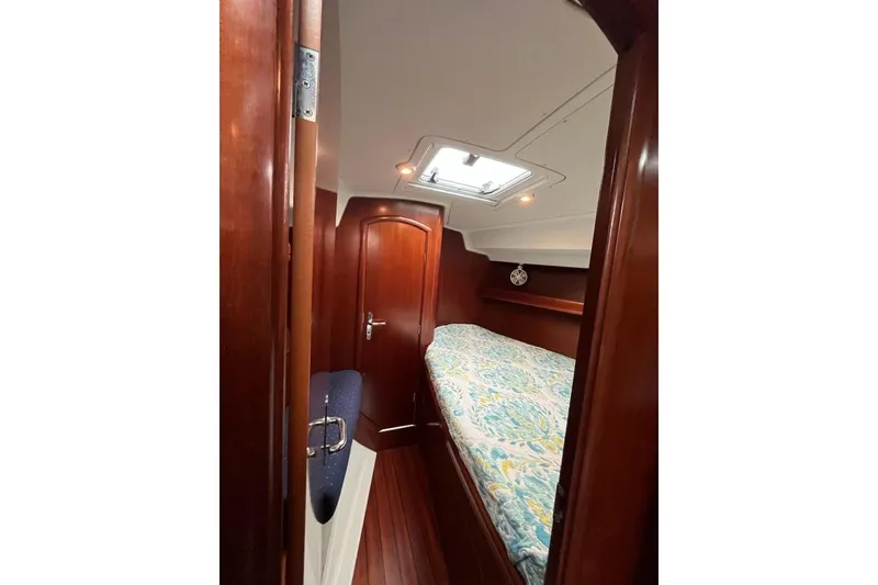 Slide: The Image of Cozy cabin interior of 2003 Beneteau Oceanis 42CC sailboat with wooden finish. - 57