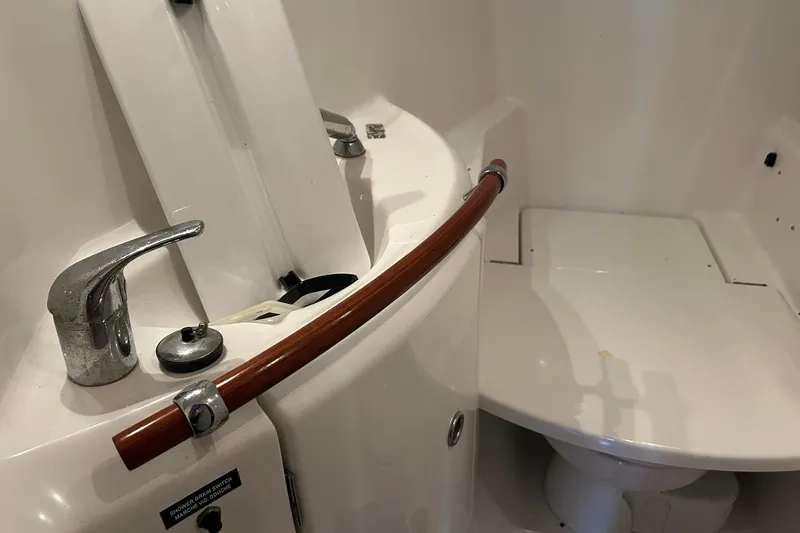 Slide: The Image of Bathroom interior of 2003 Beneteau Oceanis 42CC yacht, featuring sink and faucet. - 61