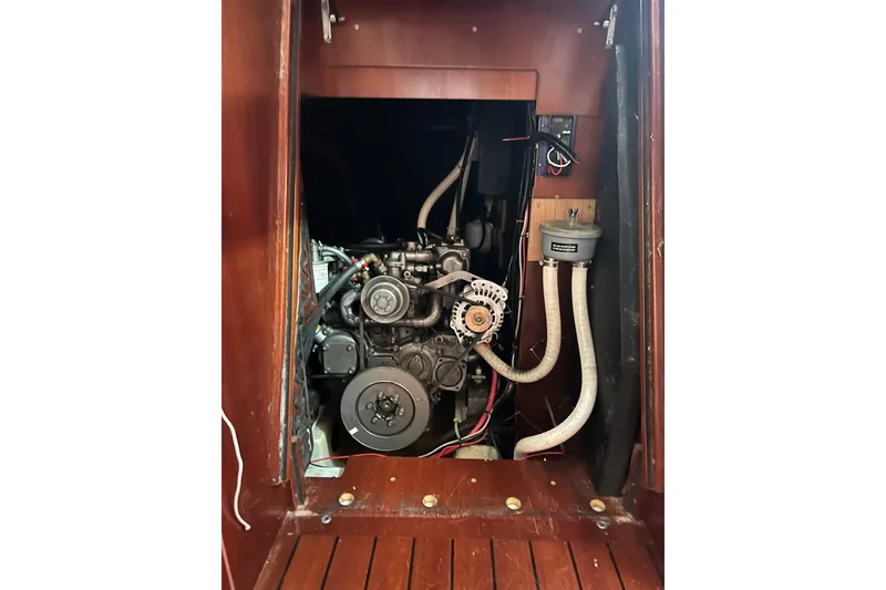 Slide: The Image of Engine compartment of 2003 Beneteau Oceanis 42CC sailboat, showcasing mechanical components. - 66