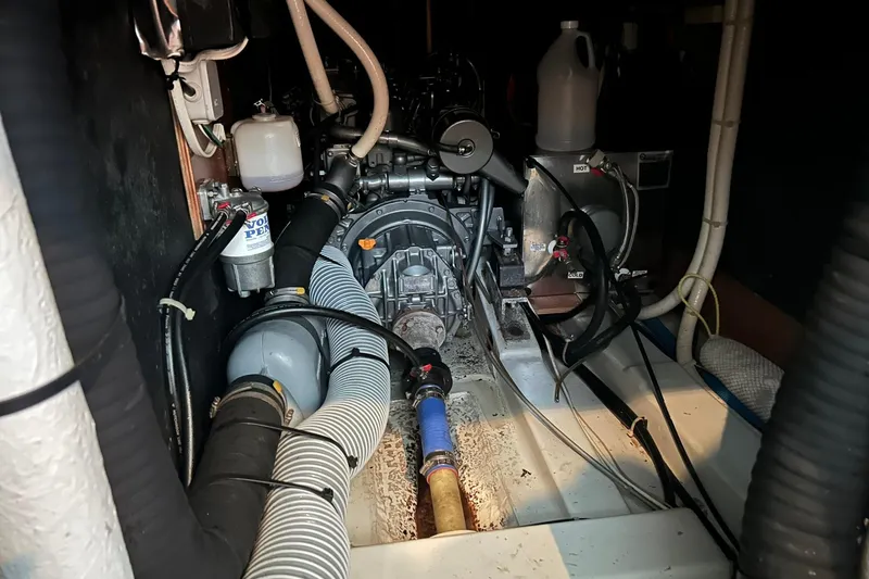 Slide: The Image of Engine room of a 2003 Beneteau Oceanis 42CC sailboat, showcasing mechanical components. - 67